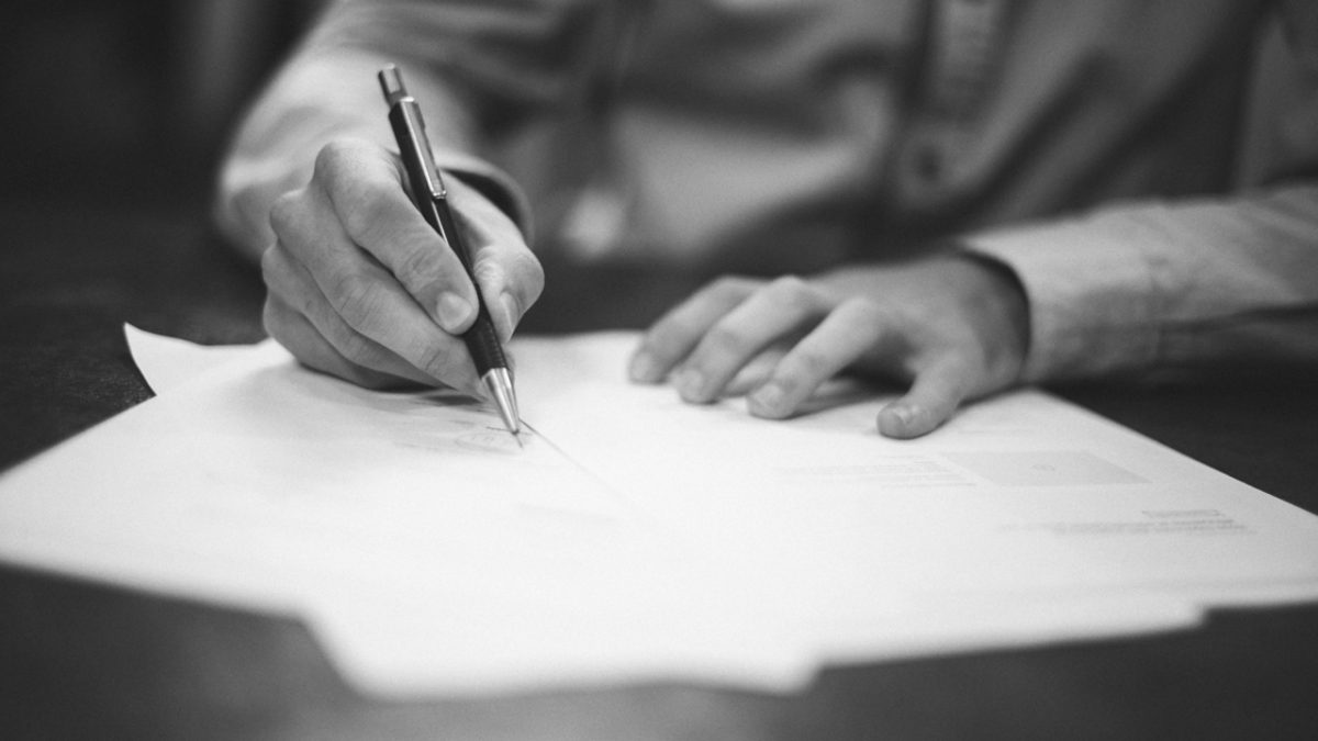 Man signing documents