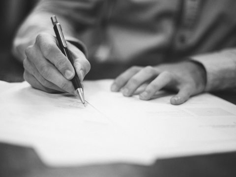 Man signing documents