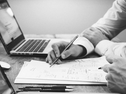 two people reviewing a document