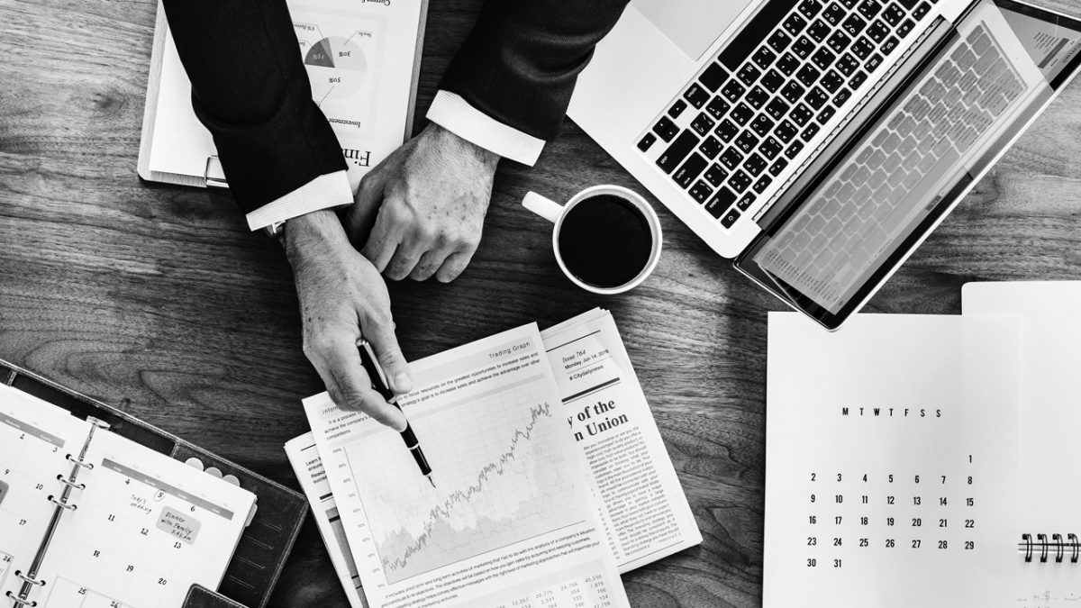 man in an office reviewing a financial document