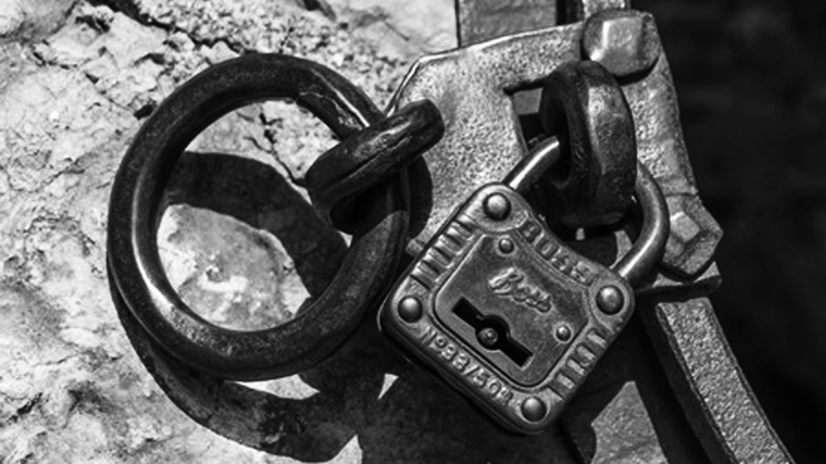 Padlock with rusty chain